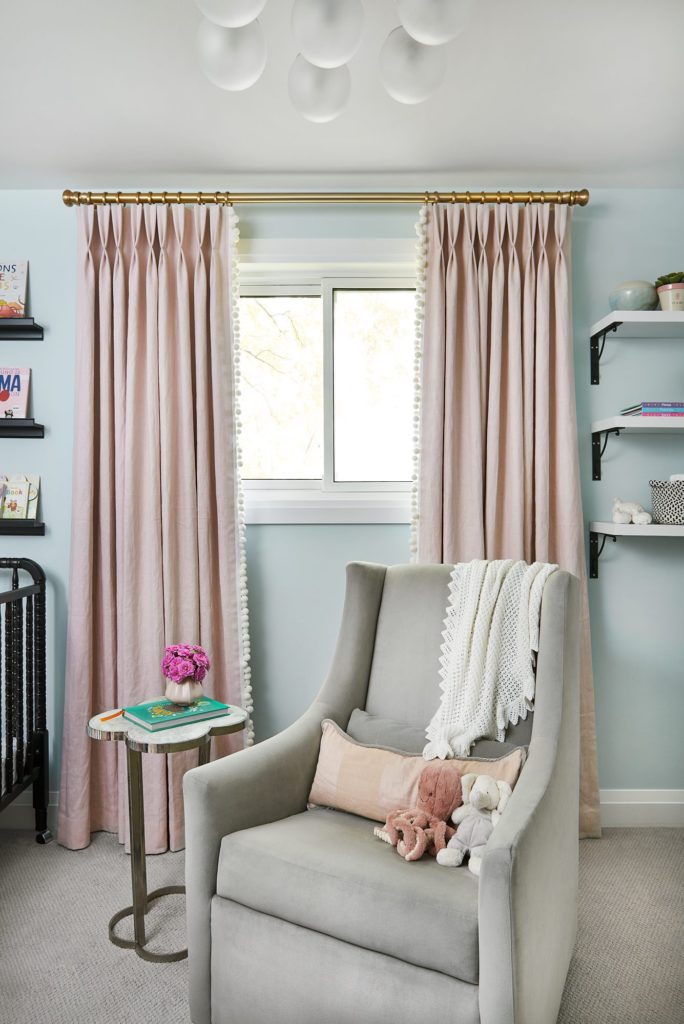 Dusty rose drapery beside a grey wingback chair
